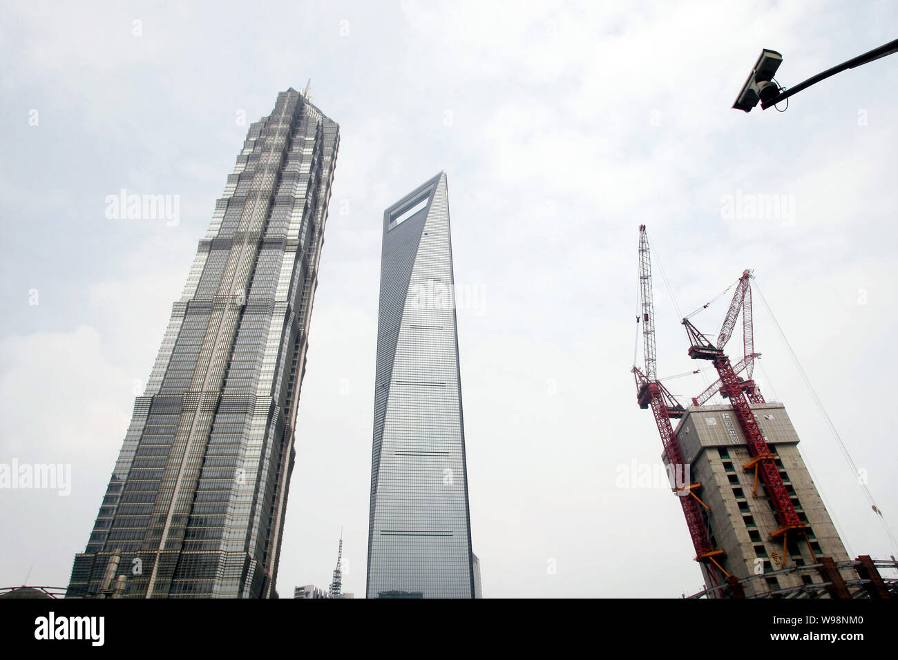 The Shanghai Tower, right, is under construction next to Jinmao Tower ...