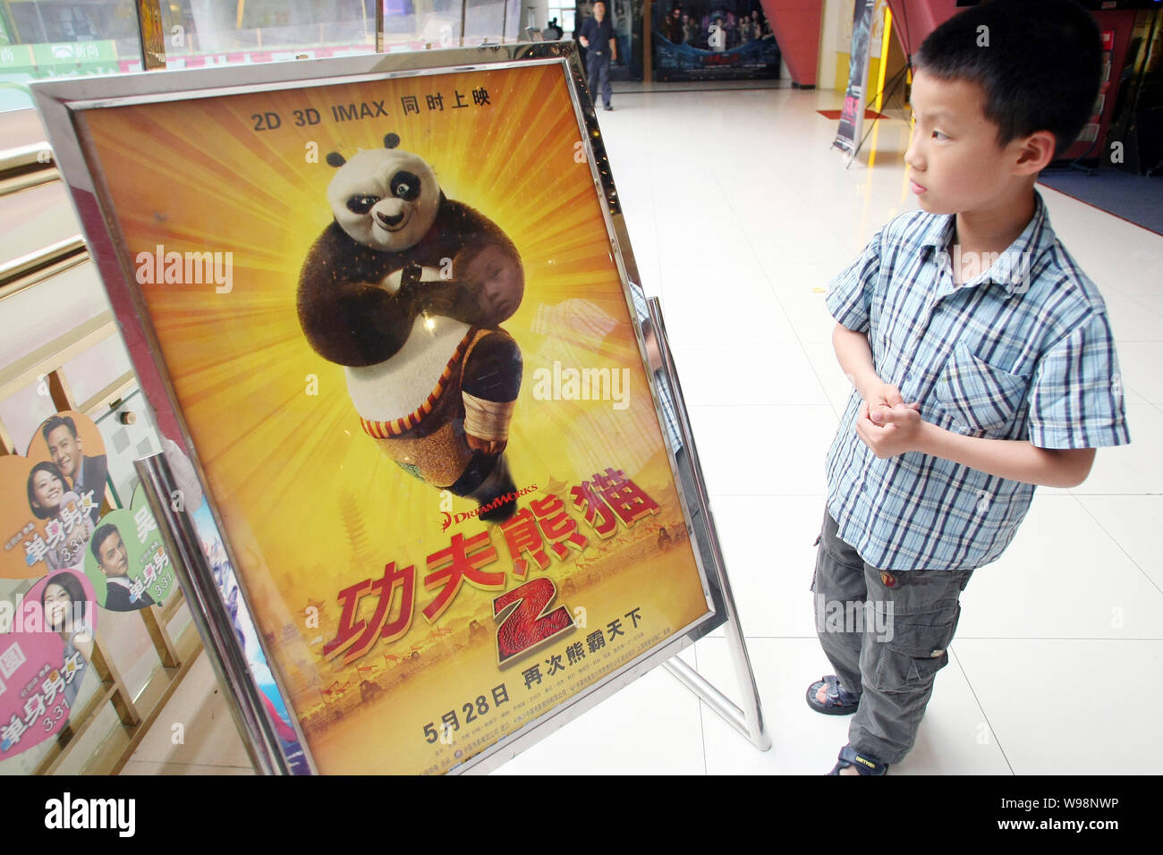 A Chinese Boy Looks At A Poster Of Kung Fu Panda 2 At A Movie Theatre In Shanghai China 1 June 2011 Kung Fu Panda 2 Has Already Earned Over 100 Mi Stock Photo Alamy