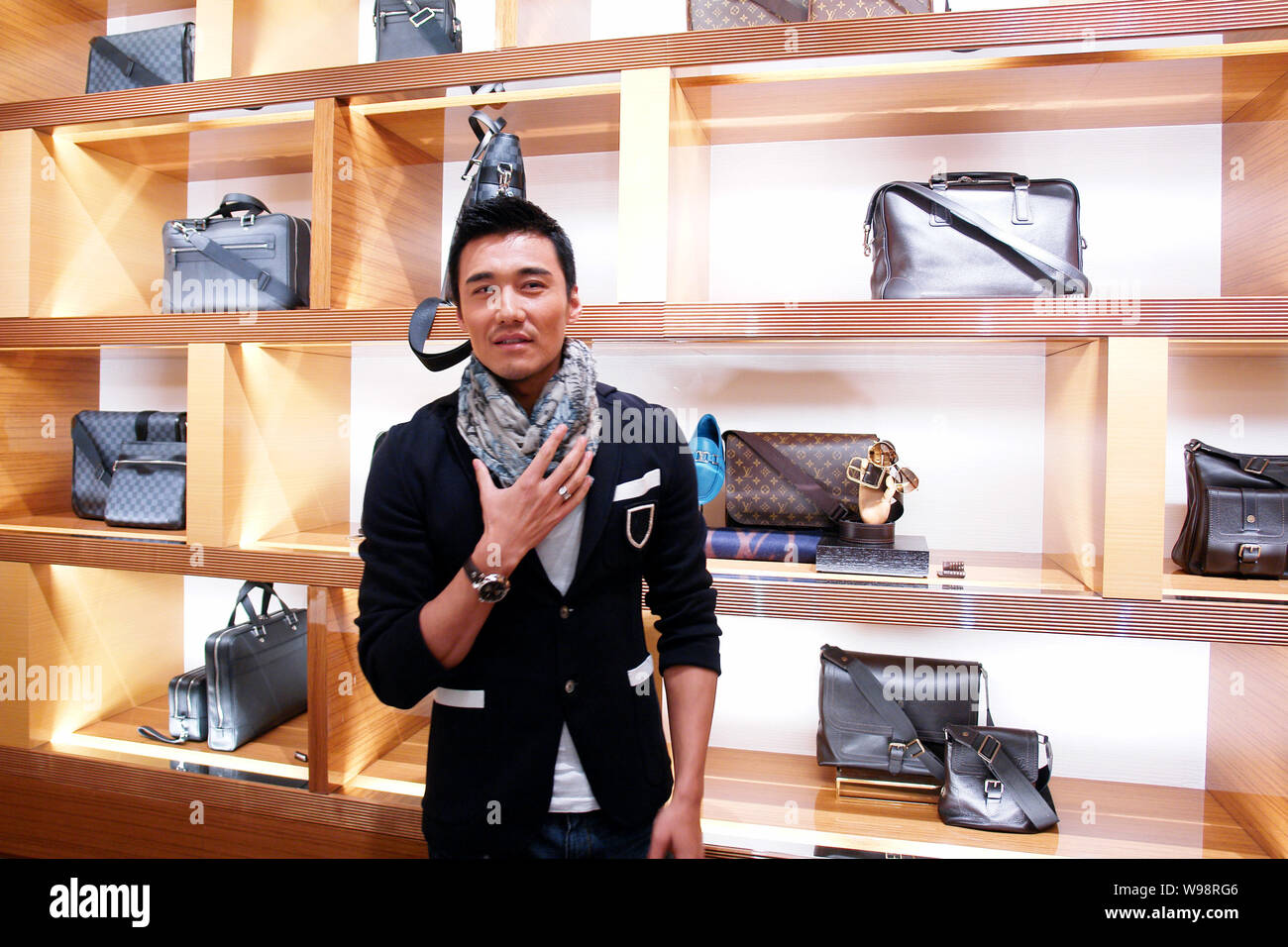 Chinese actor Hu Bing poses during the opening ceremony of a Louis Vuitton ( LV) store in Zhengzhou city, central Chinas Henan province, 29 January 201  Stock Photo - Alamy