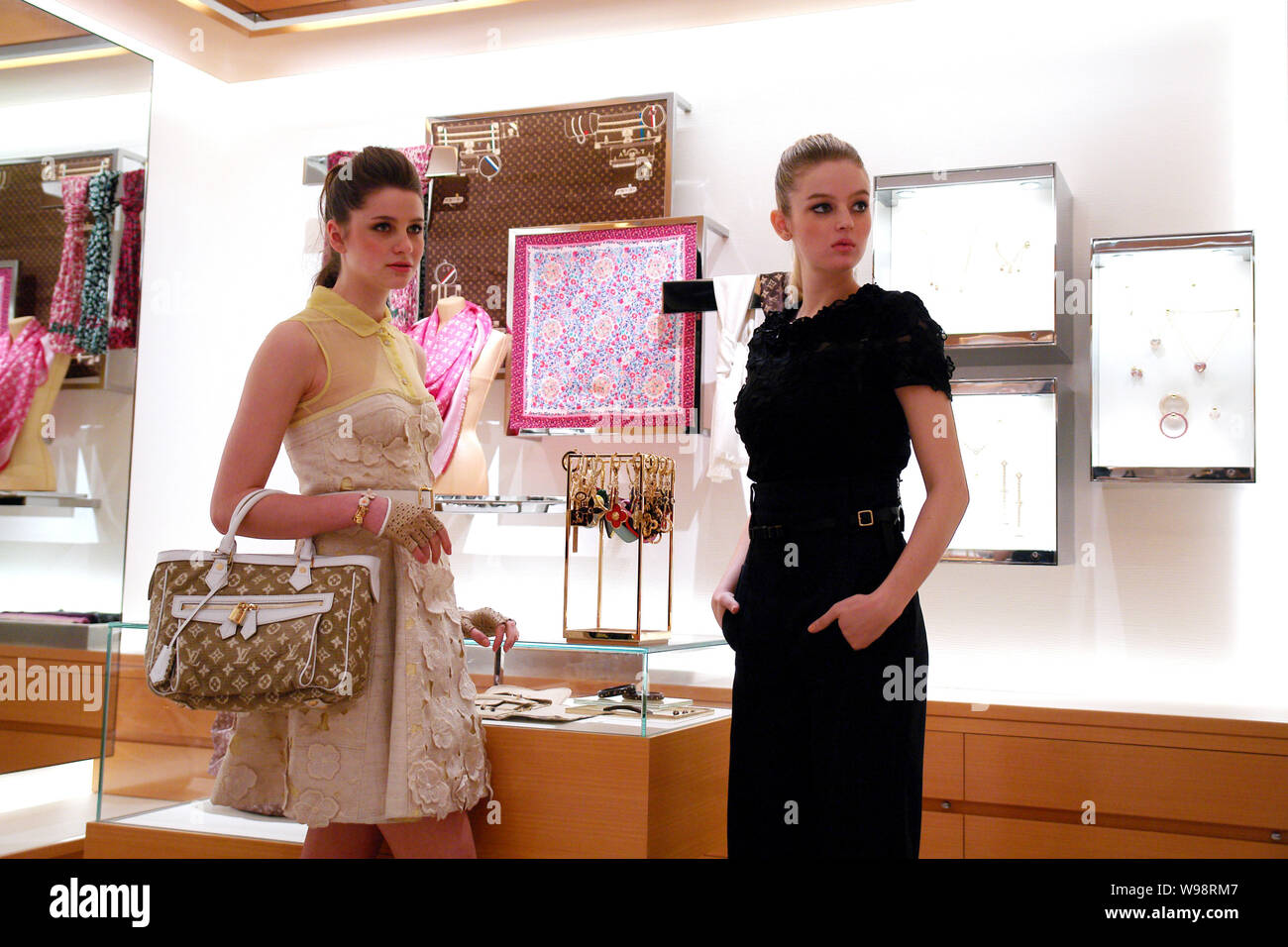 Models pose during the opening ceremony of a Louis Vuitton (LV