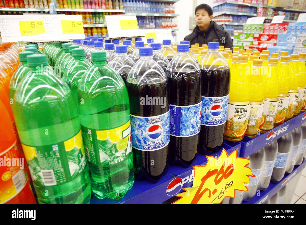A Chinese customer shops for beverages of PepsiCo at a supermarket in