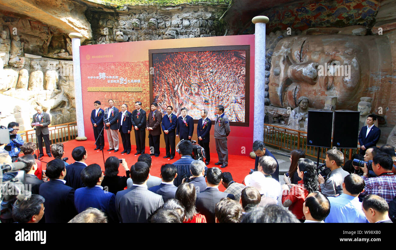 Guests attend a launching ceremony for the restoration of the Thousand Hand Bodhisattva (Guanyin), part of Chongqing municipalitys Dazu Rock Carvings, Stock Photo