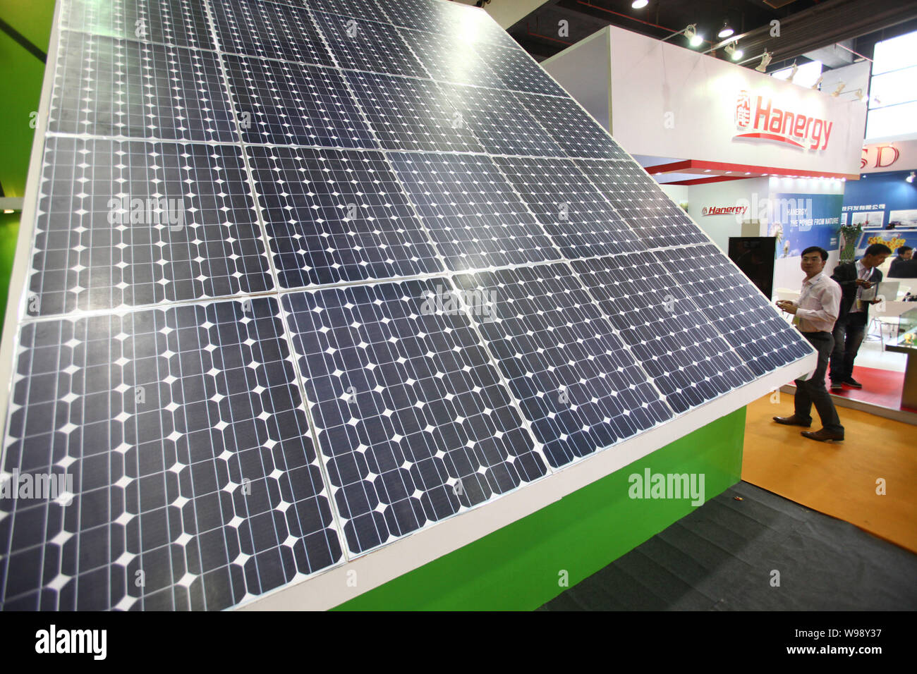 Asian Code Solar Panel A visitor walks past a large solar panel at the 6th Asia Solar ...