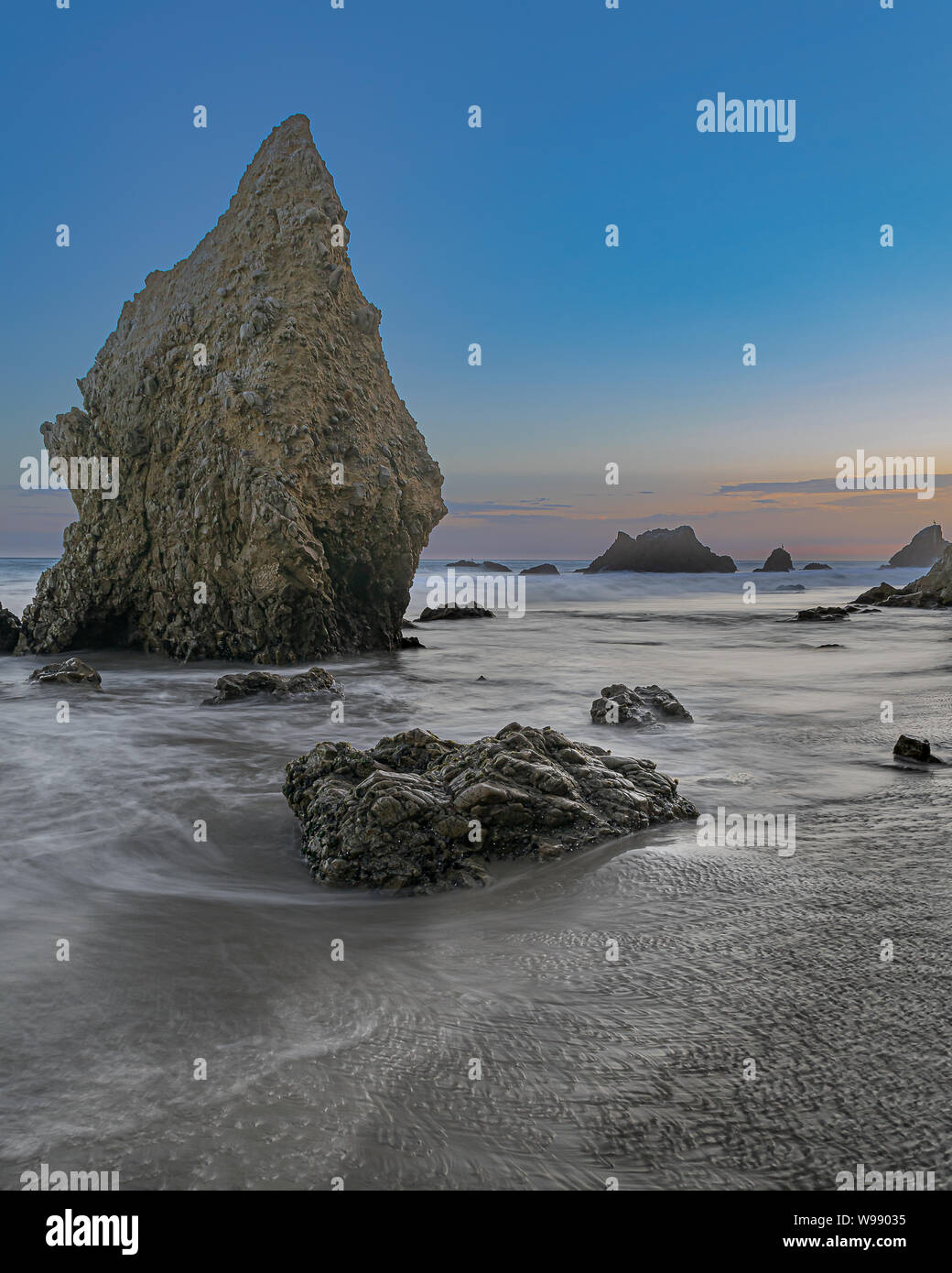 The unique rock formations and amazing sunset views are big two reasons for the popularity of El Matador beach near Malibu in southern California. Stock Photo