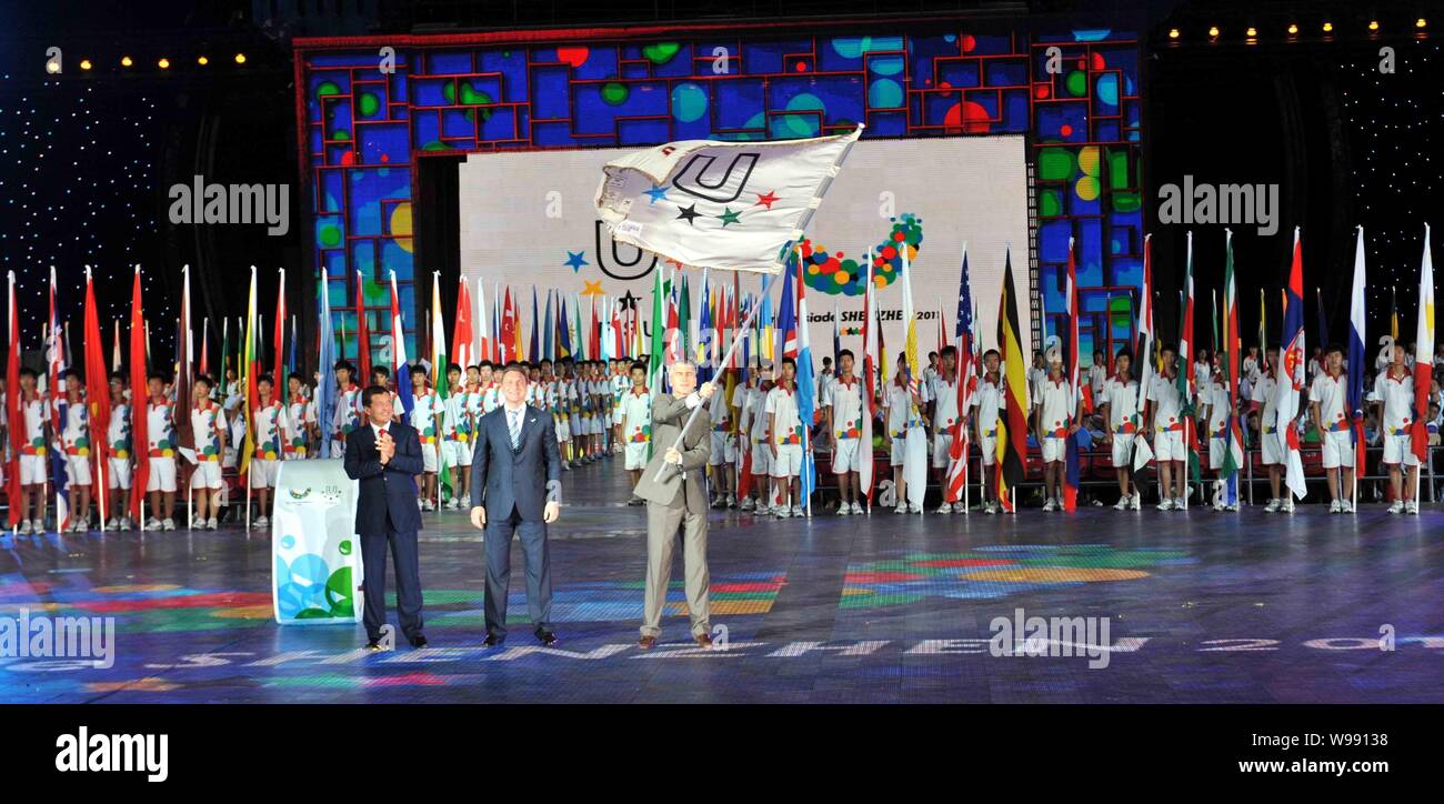 A representative of Kazan flourishes the FISU flag at the closing ceremony of 26th Summer Universiade in Shenzhen, south Chinas Guangdong province, Ch Stock Photo