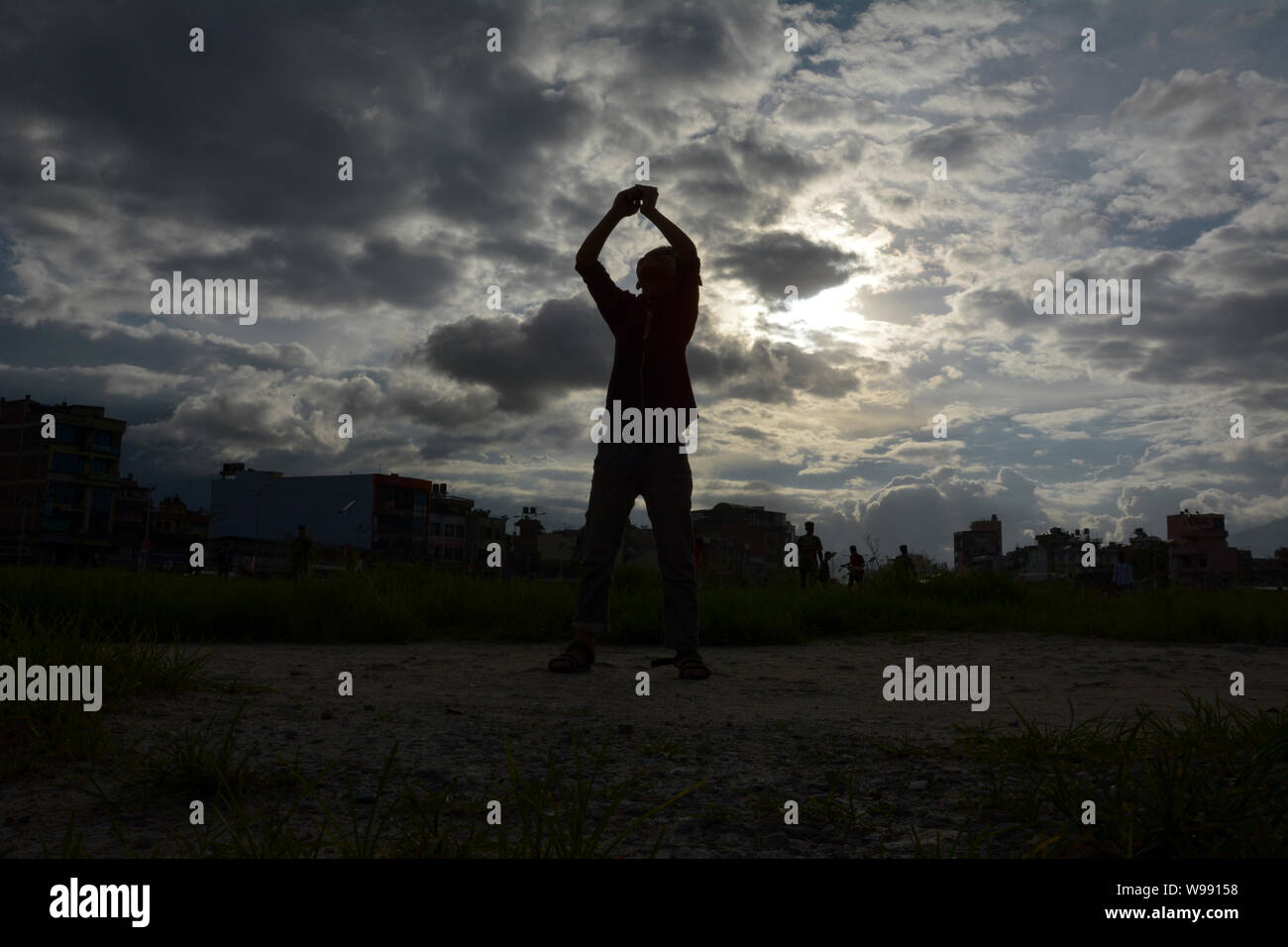 A boy takes selfie at Tinkune park in the evening. Stock Photo