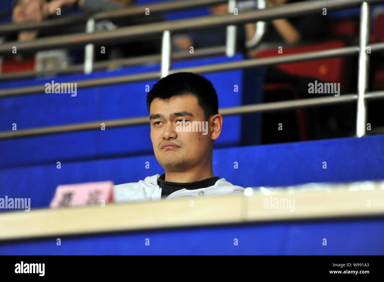 Retired Chinese basketball player Yao Ming is pictured during a CBA game between Shanghai Sharks and Xinjiang Flying Tigers in Shanghai, China, 14 Dec Stock Photo