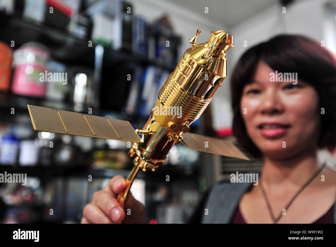 A model of the Tiangong1 space lab module is for sale at a stationery