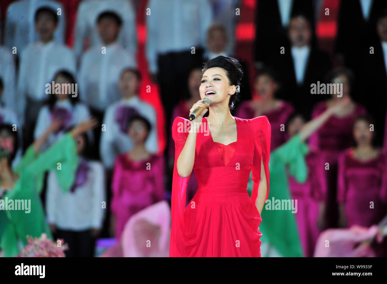Chinese singer Tan Jing performs at a celebration for the centennial of