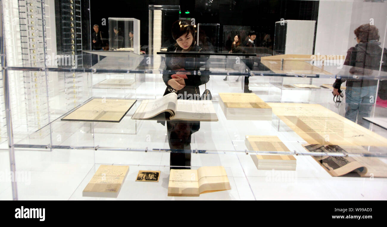 Visitors look at books about Chanel during the Culture Chanel exhibition at the Art Museum of China in Beijing, China, 6 November 2011. The Stock Photo - Alamy