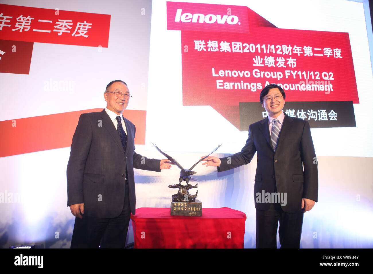 Liu Chuanzhi (L), founder and former chairman of Lenovo Group, is seen ...