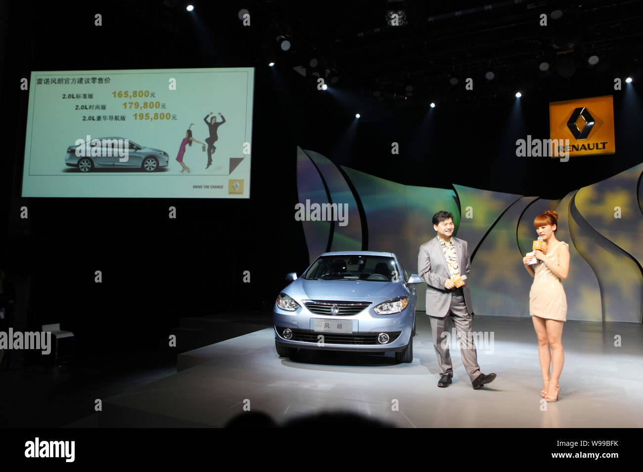 --FILE--Two hosts present the Renault Fluence at the 798 Art District in Beijing, China, 9 June 2011.  Whether or not Renault begins manufacturing car Stock Photo