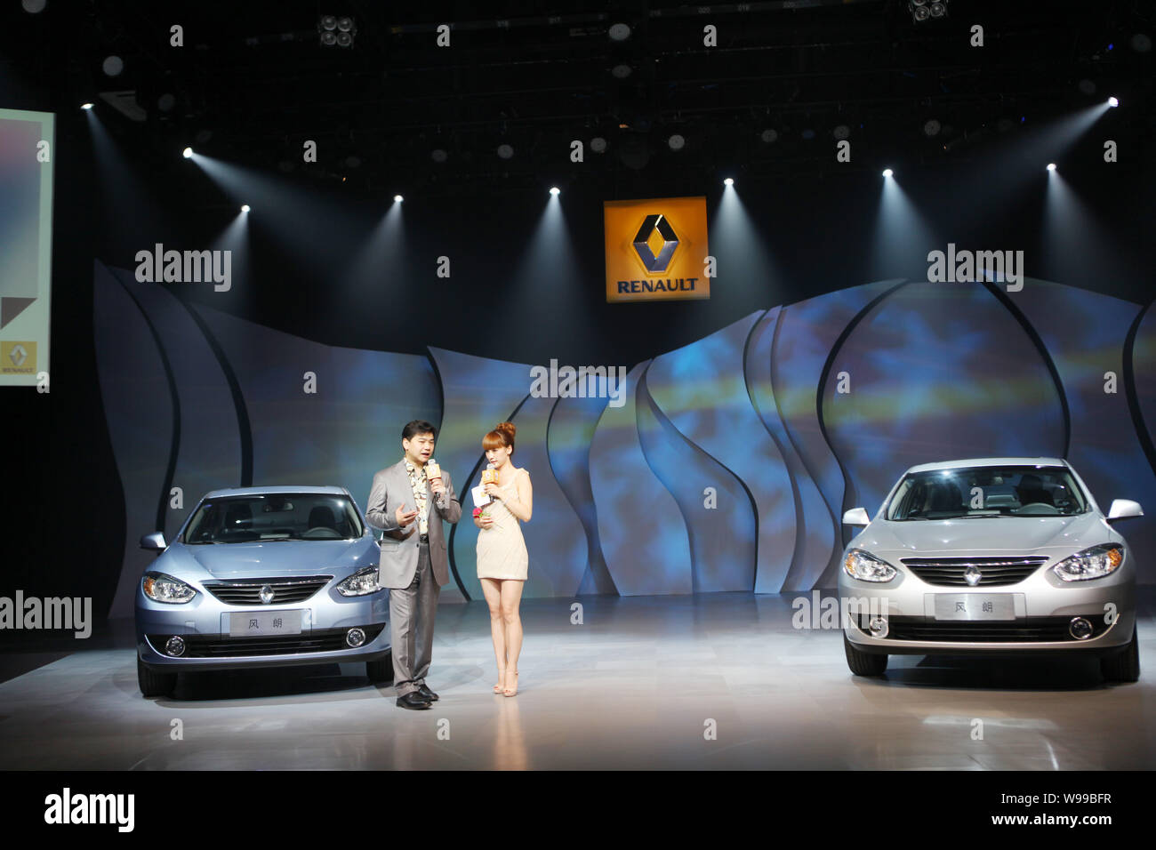 --FILE--Two hosts present the Renault Fluence at the 798 Art District in Beijing, China, 9 June 2011.  Whether or not Renault begins manufacturing car Stock Photo