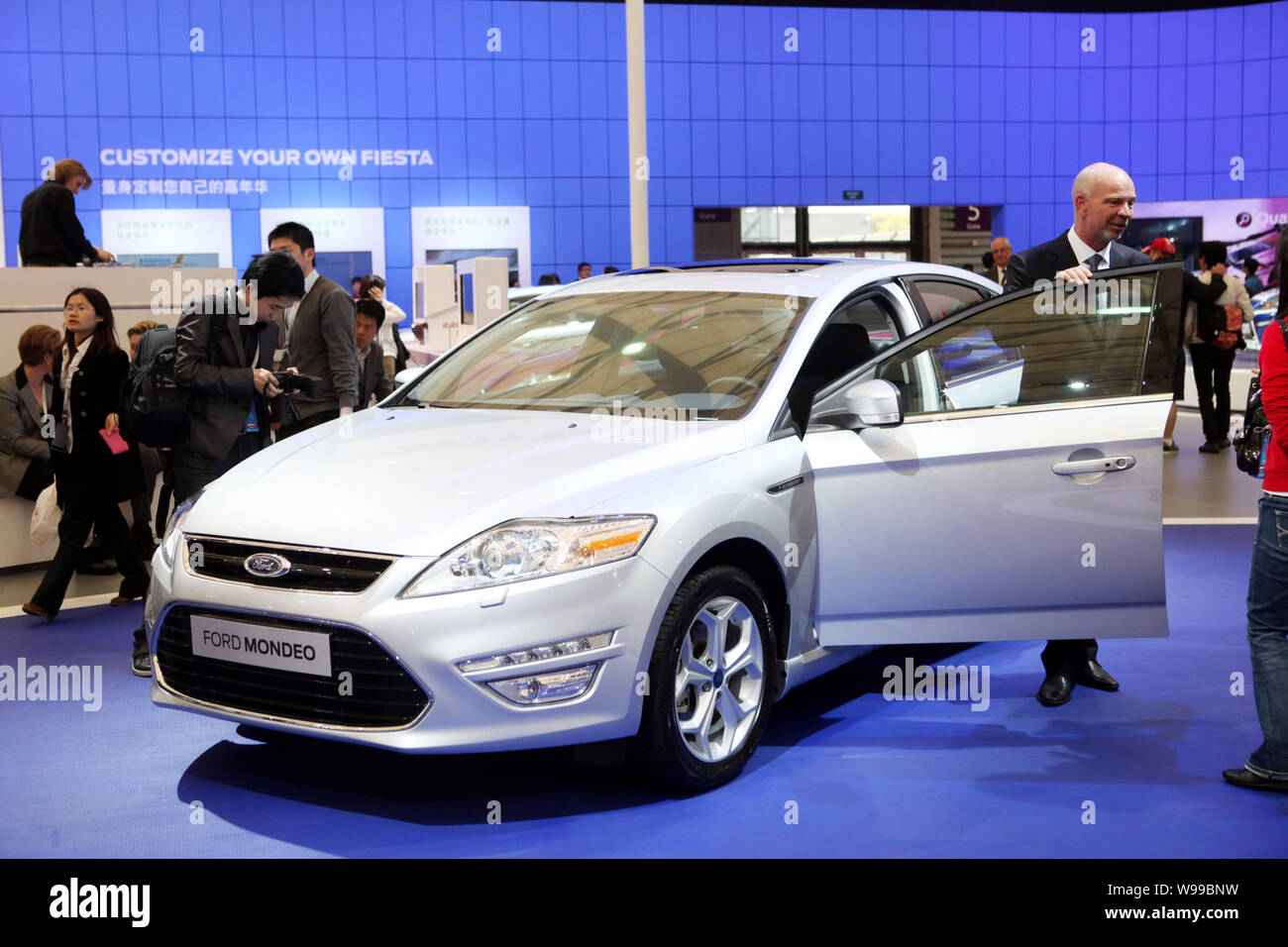 --FILE--Visitors look at the Ford Mondeo at the 14th Shanghai International Automobile Industry Exhibition, known as Auto Shanghai 2011, in Shanghai, Stock Photo