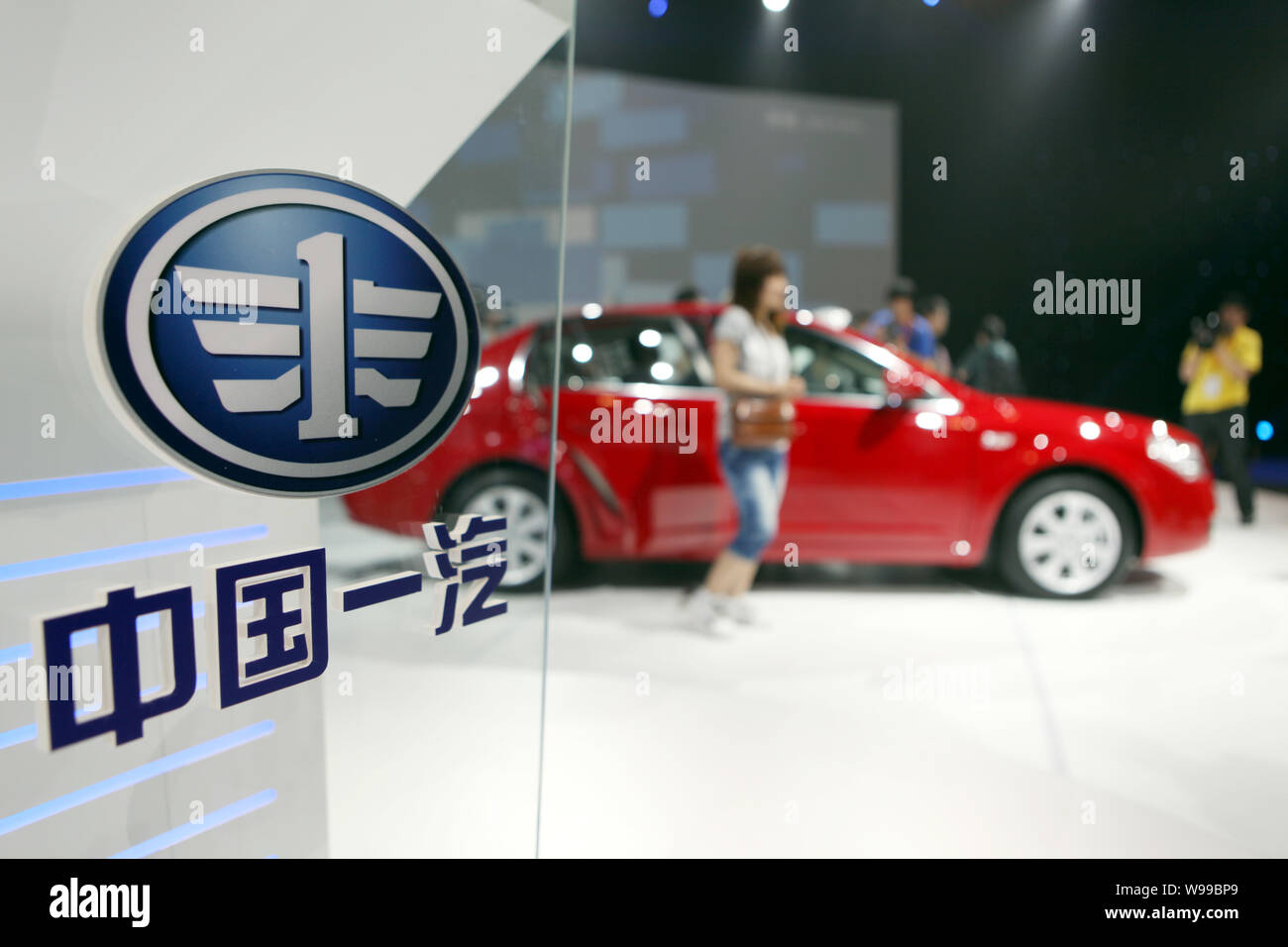 --FILE--Visitors look at the FAW B70 during a launch ceremony in Beijing, China, 18 May 2011.   Major Chinese state automaker FAW Group is seeking reg Stock Photo