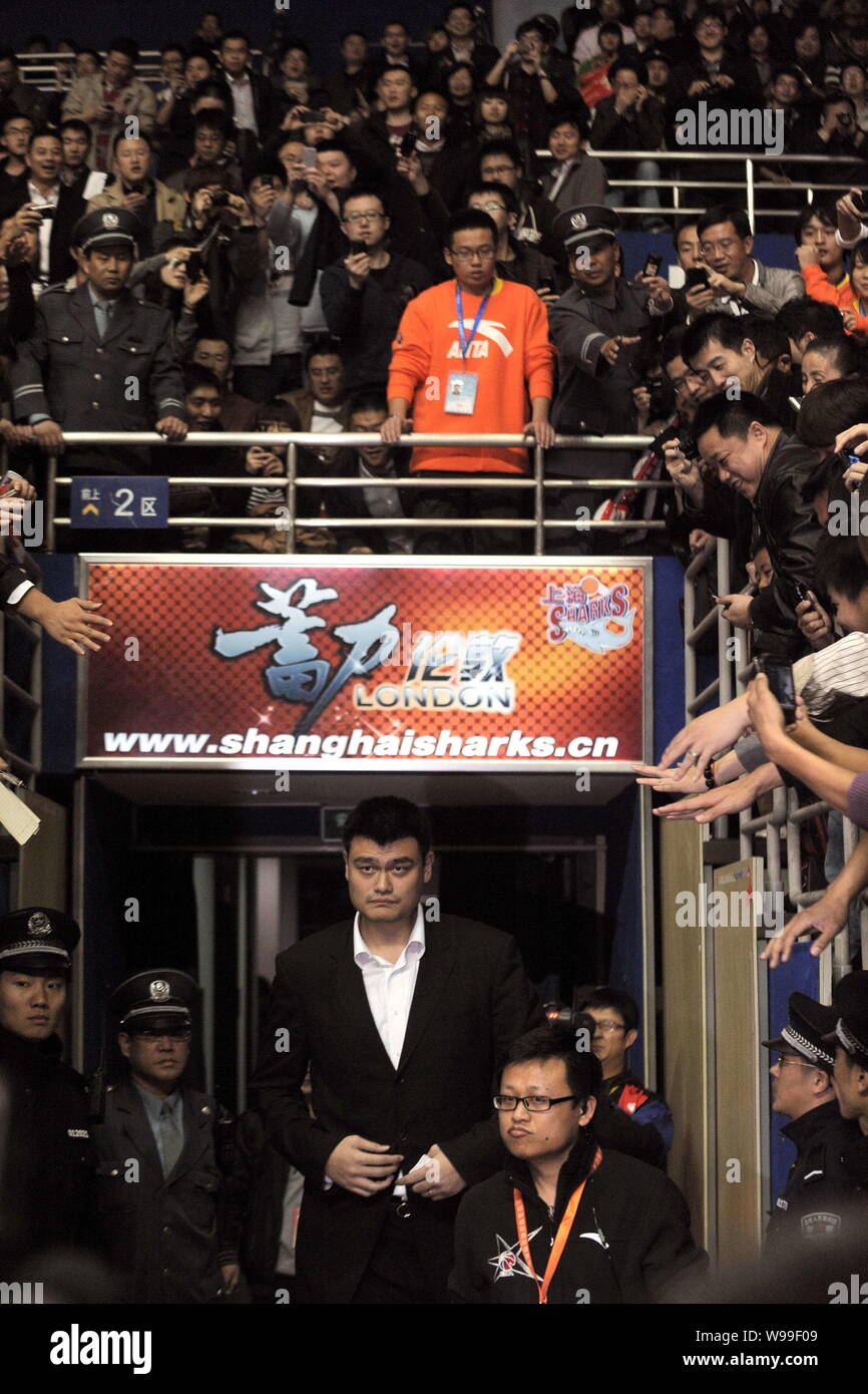 Retired Chinas basketball star and Shanghai Sharks owner Yao Ming is pictured during a CBA match between Shanghai Sharks and Zhejiang Guangsha Lions i Stock Photo