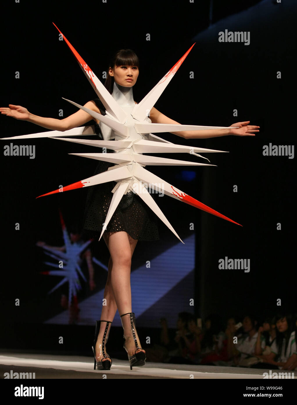 a model wearing distinctive garment poses on the stage during 2011 jiangsu creative fashion week in nanjing east chinas jiangsu province 8 september W99G46