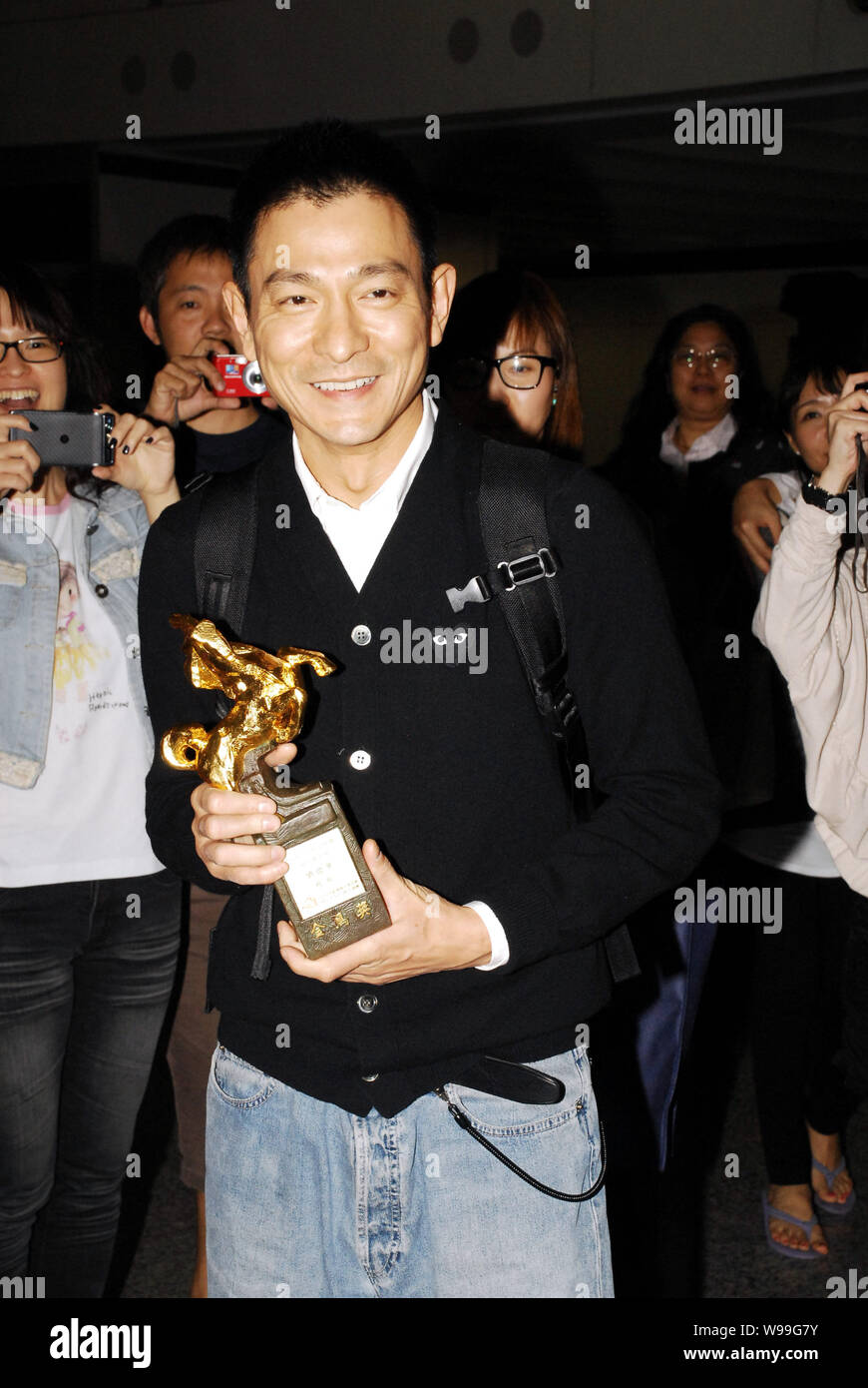 Andy Yu Hong Kong singer and actor Andy Lau holds his trophy for the Best Actor ...