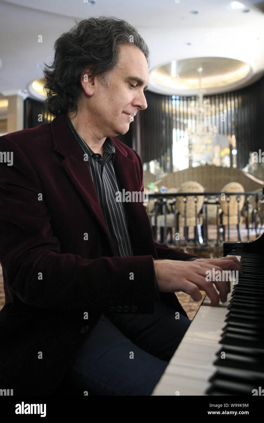 Peter Buffett, American musician, composer and author and second son of investor Warren Buffett, plays the piano during an interview for his new book, Stock Photo