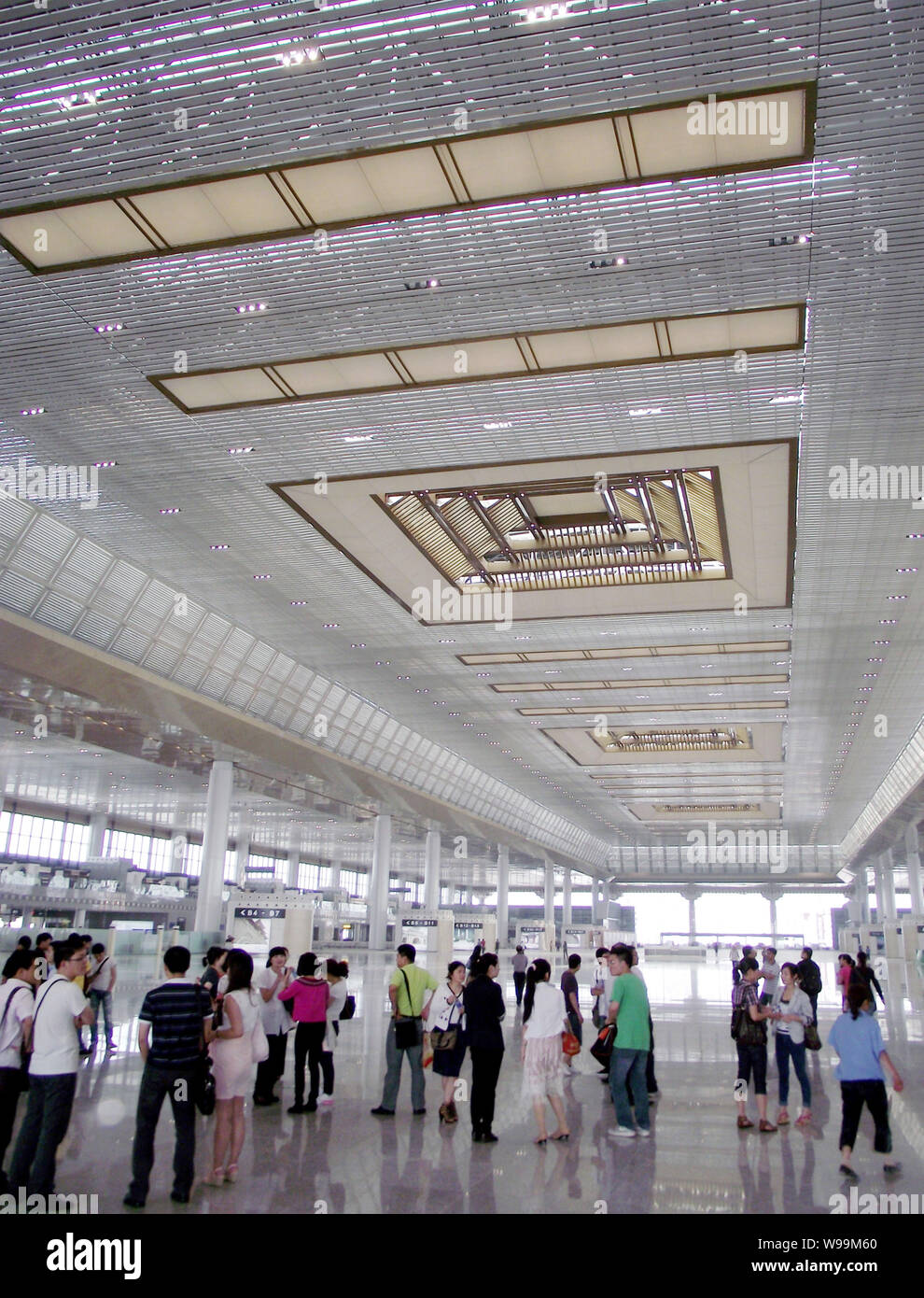 People visit the Nanjing South Railway Station, part of the Beijing-Shanghai High-speed Railway project, in Nanjing city, east Chinas Jiangsu province Stock Photo