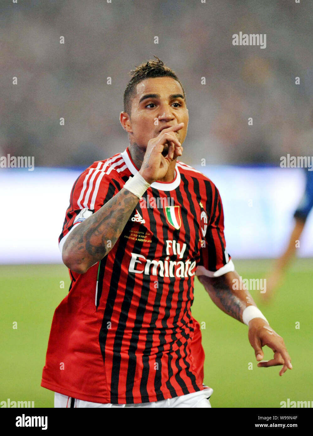 Kevin-Prince Boateng of AC Milan celebrates after scoring against Inter Milan during the Italian Super Cup 2011 match at the National Stadium, known a Stock Photo