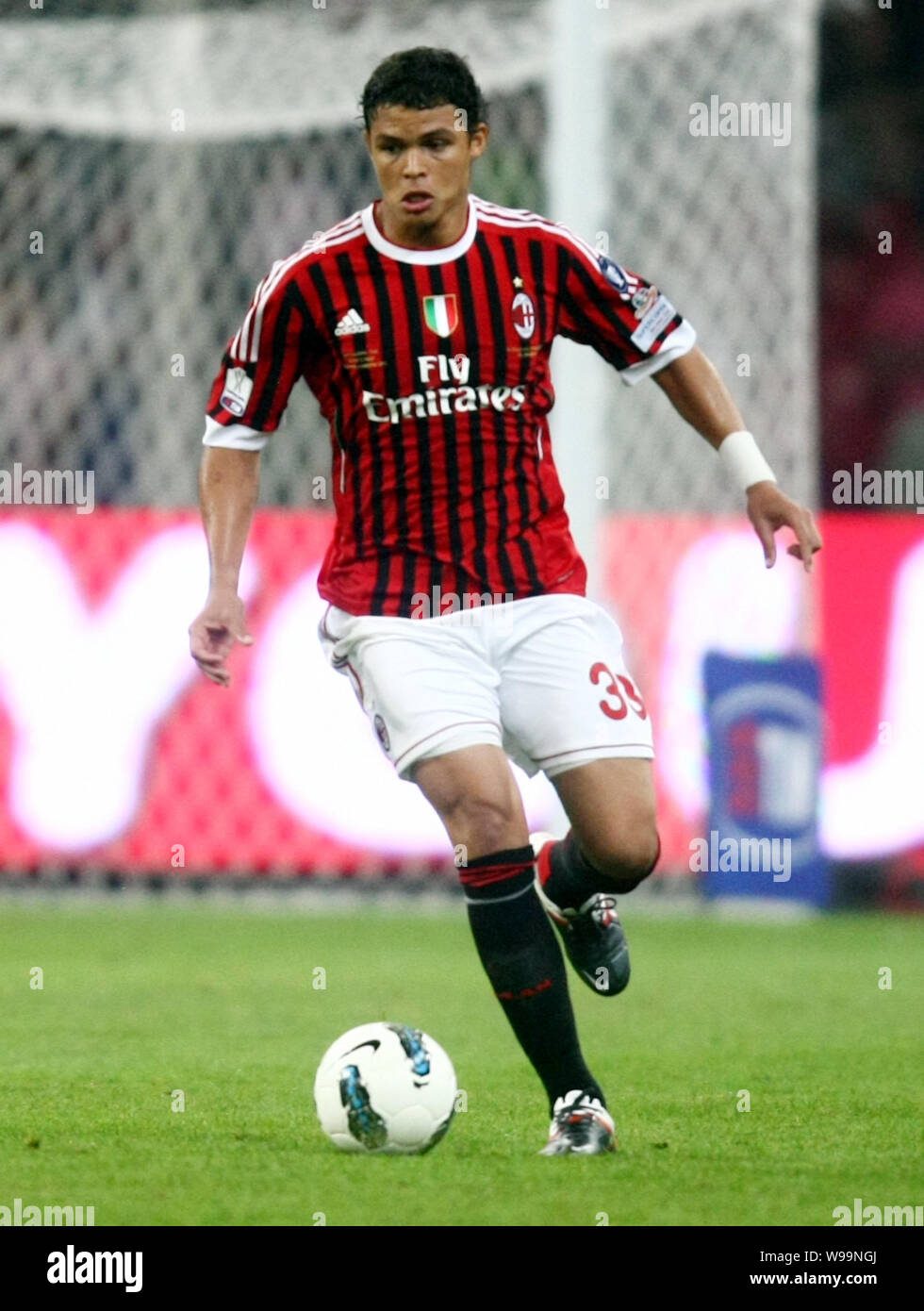 courtyard Faithful construction Thiago Emiliano da Silva of AC Milan dribbles during the Italian Super Cup  2011 match against Inter Milan at the National Stadium, known as the Birds  Stock Photo - Alamy
