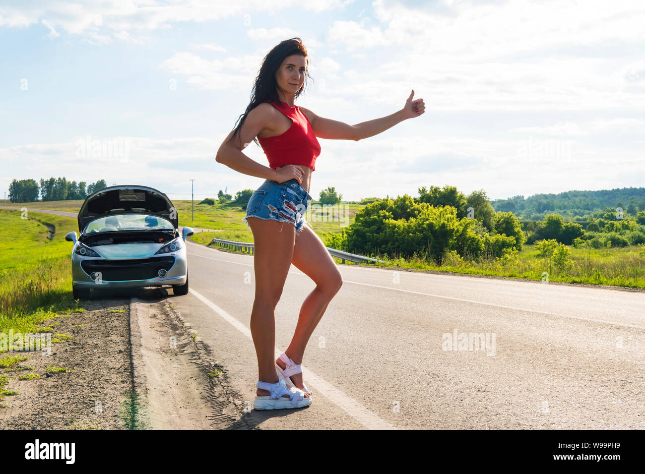 Beautiful Woman Hitchhiking By A Broken Car Girl Stands At His Car And Waiting For Help