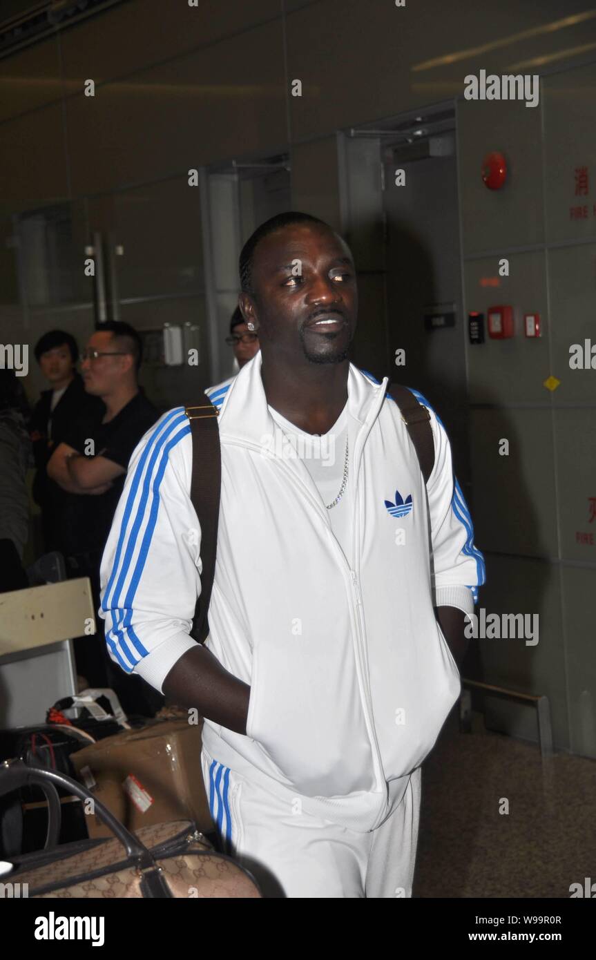 Senegalese-American R&B singer Aliaune Damala Badara Thiam, better known as Akon, is pictured at Hongqiao International Airport in Shanghai, China, 13 Stock Photo
