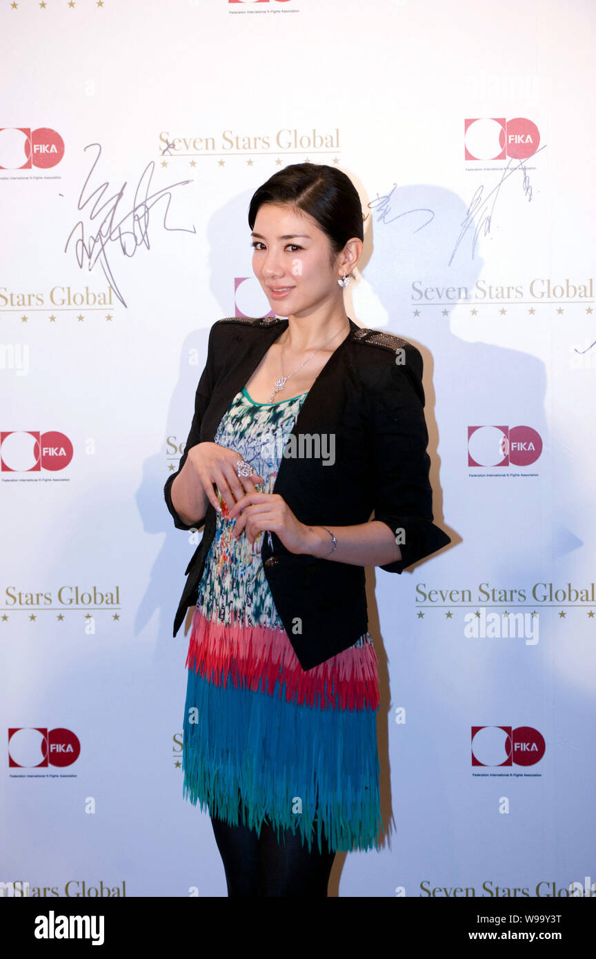 Chinese actress Huang Yi attends a signing ceremony and press