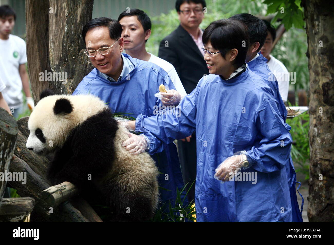 Hong Kong SAR (Special Administrative Region) Chief Executive Donald Tsang Yam-kuen, left, and his wife Selina Tsang Pau Siu-Mei, right, President of Stock Photo