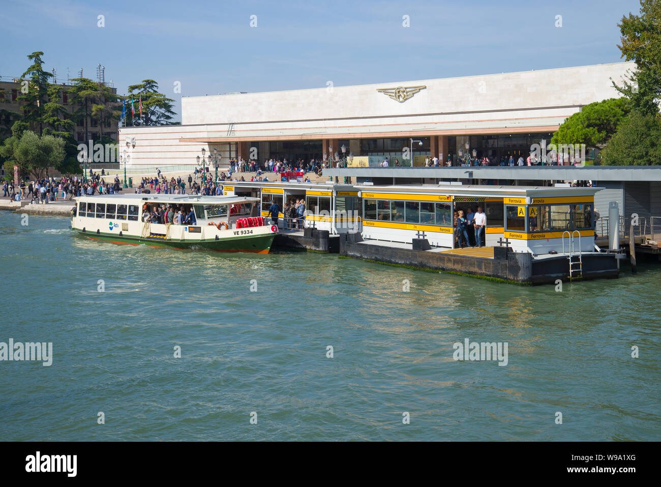 VENICE, ITALY - SEPTEMBER 28, 2017: View of the railway station building and the Ferrovia vaporetto stop on the Grand Canal Stock Photo