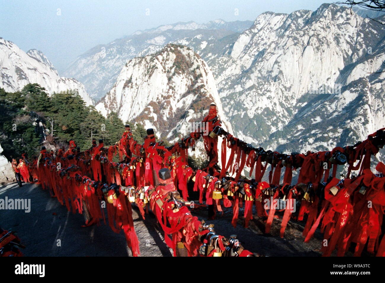 FILELocks of love, peace and other wishes with red ribbons are hung