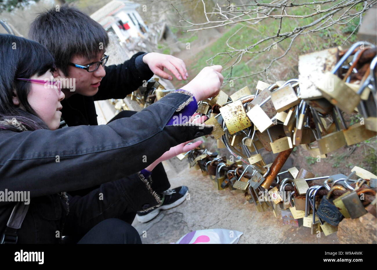 FILEChinese tourists hang their locks of wishes on the iron chains