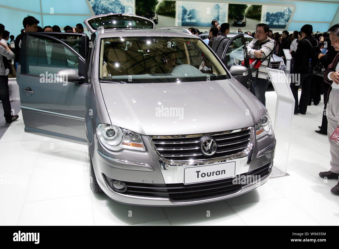 FILE-- Visitors look at a Shanghai Volkswagen (VW) Touran during the Auto  Shanghai 2009 in Shanghai, China, April 27, 2009. SAIC Motor Corporation  Stock Photo - Alamy