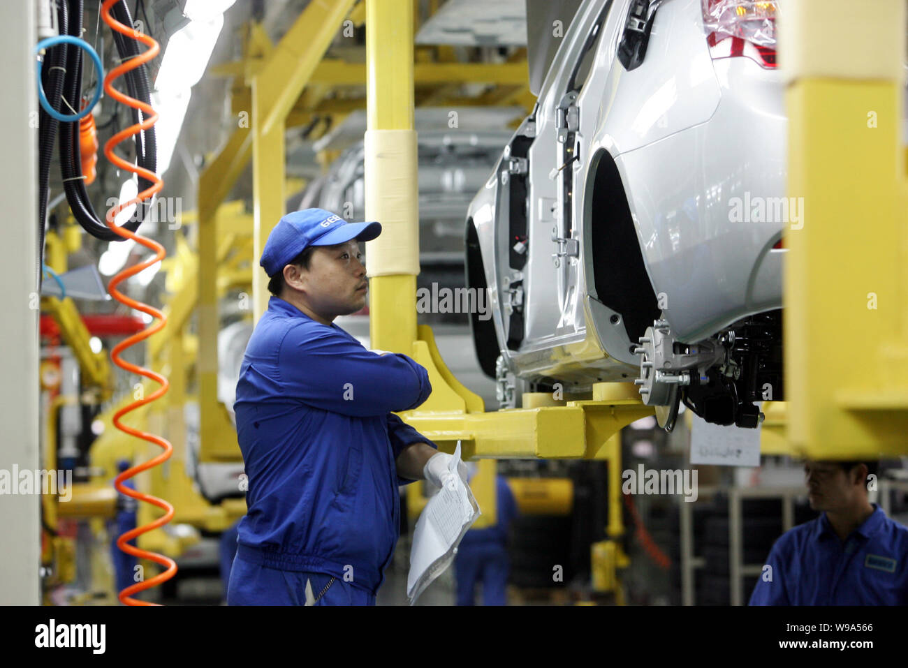 FILEChinese factory workers assemble Emgrand cars on the assembly