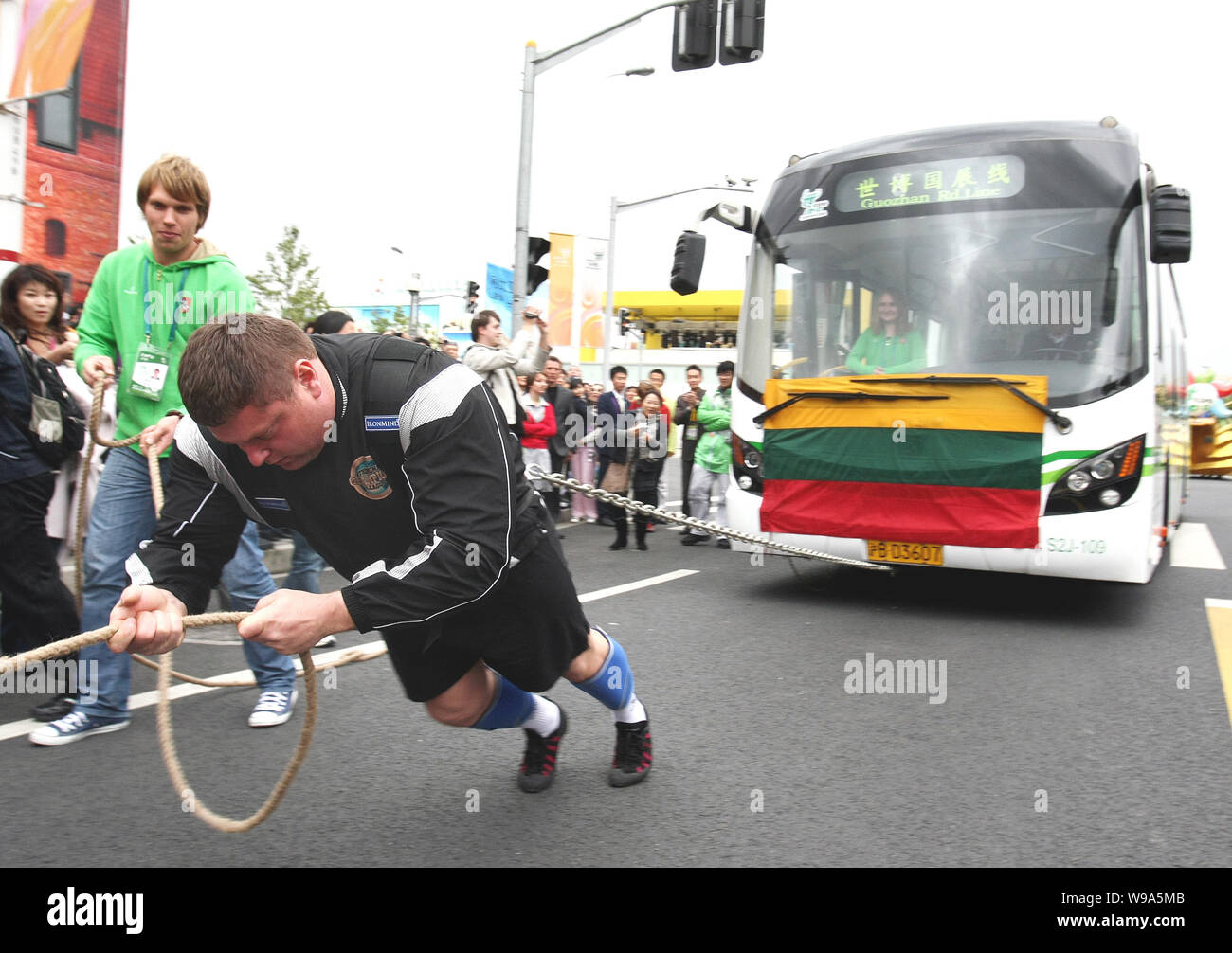 The Worlds Strongest Man title holder Zydrunas Savickas pulls a bus to ...