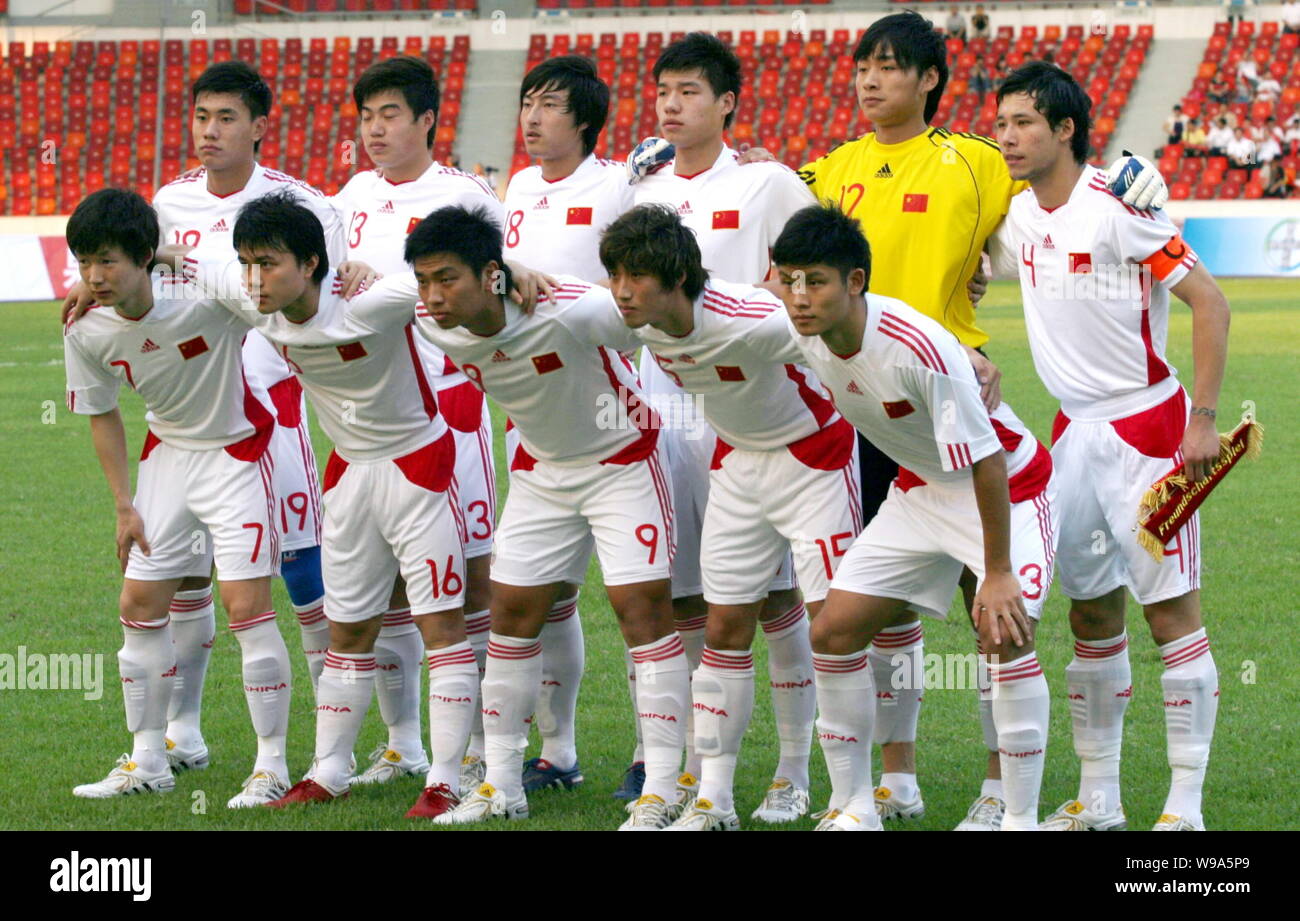 Players Of The Chinese Olympic Football Team Pose Before Vying Against Bayer 04 Leverkusen Football Club During A Friendly Soccer Match In Foshan City Stock Photo Alamy