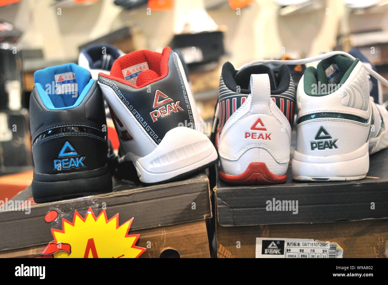 File-- Peak sneakers are seen for sale at a Peak sportswear store in  Nanjing, east Chinas Jiangsu Province, October 1, 2009. Although names like  A Stock Photo - Alamy