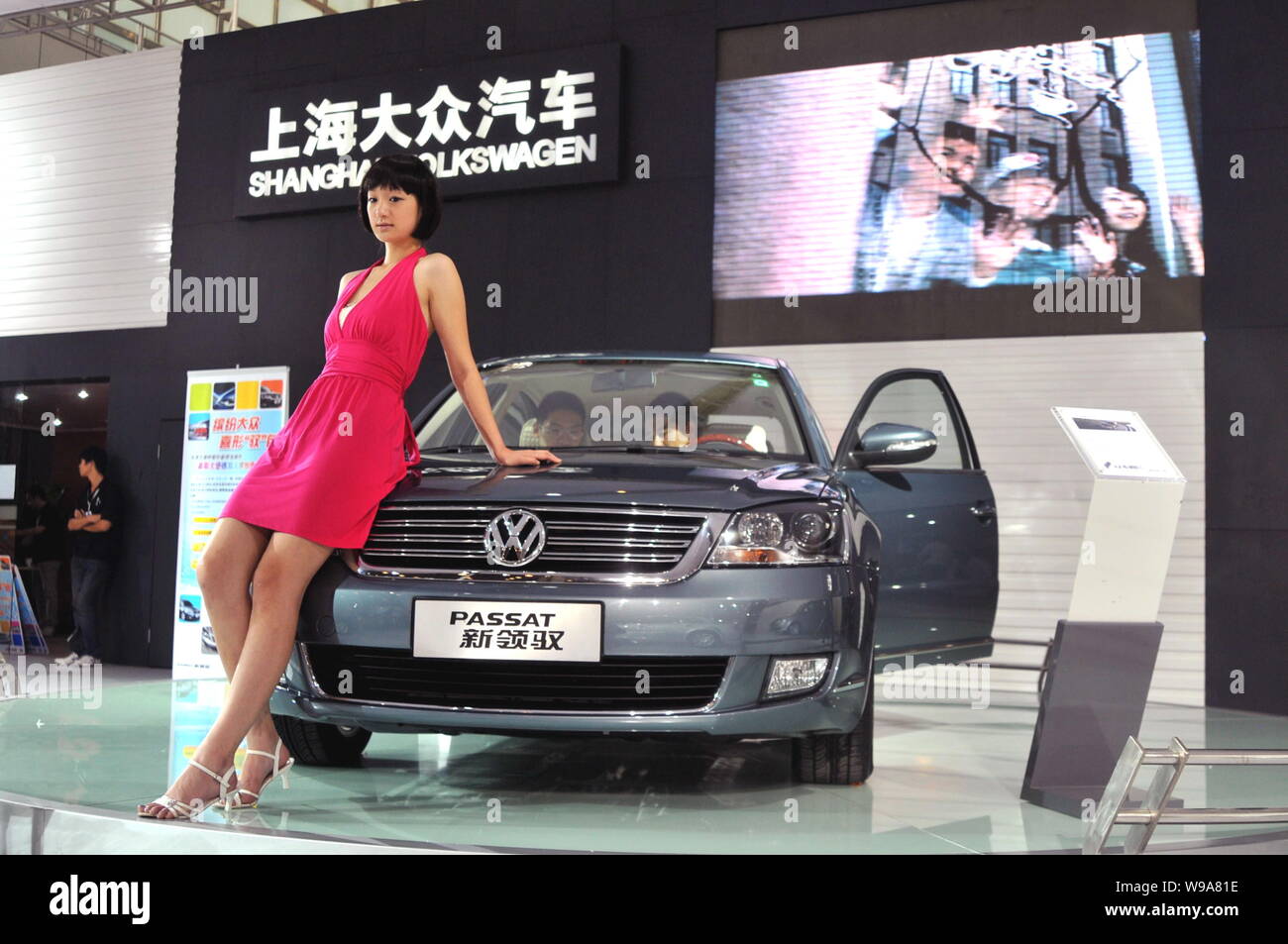 --File-- Chinese buyers try a Passat of Shanghai Volkswagen is seen on ...