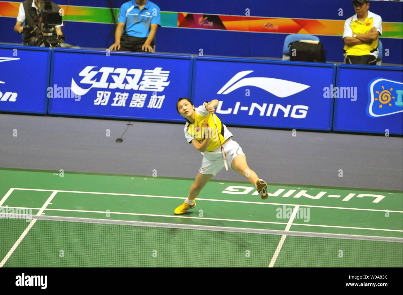 Chinas Jiang Yanjiao returns a shot to Shizuka Uchida of Japan in the eight-final of womens single of China Badminton Masters 2010 in Changzhou city, Stock Photo