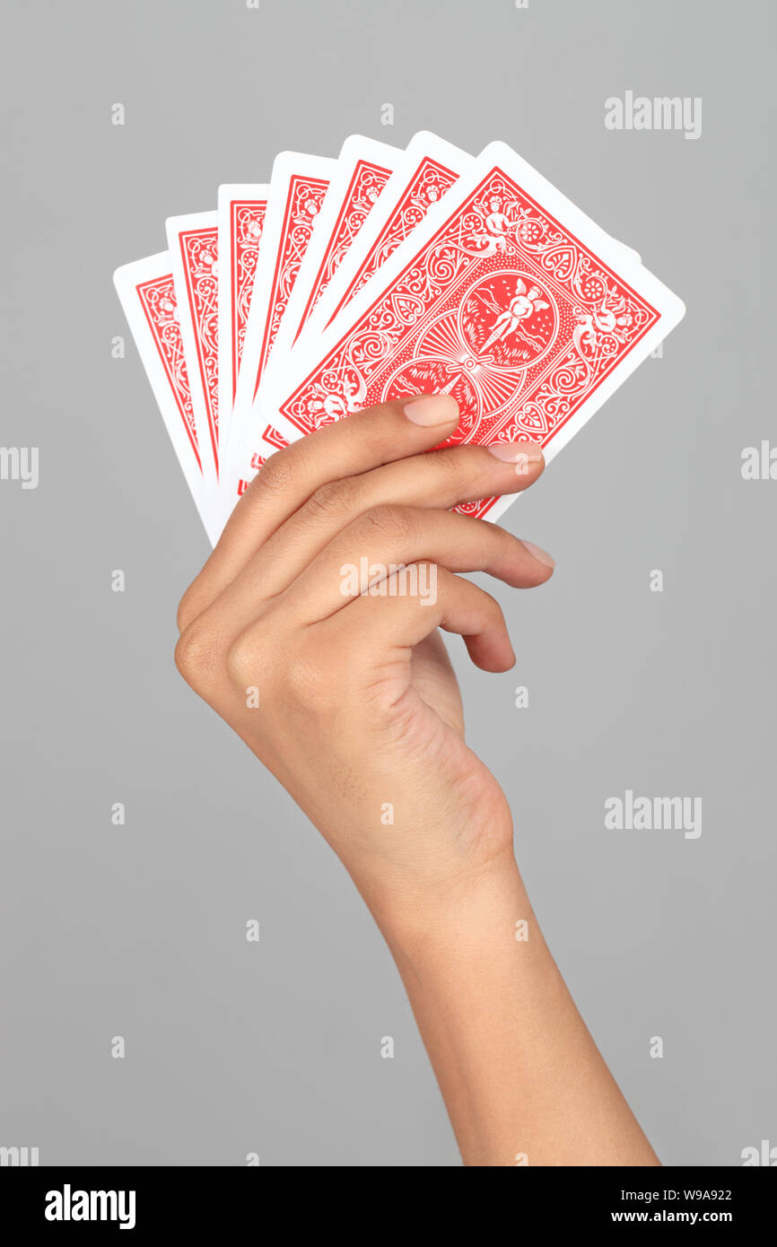 Close up of a person hand playing cards Stock Photo Alamy