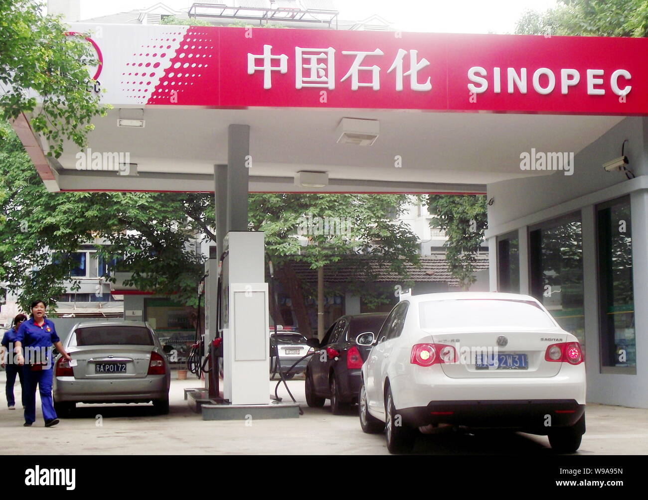 --FILE--Cars are being refueled at a gas station of Sinopec, also known as China Petrochemical Corporation or China Petroleum and Chemical Corporation Stock Photo