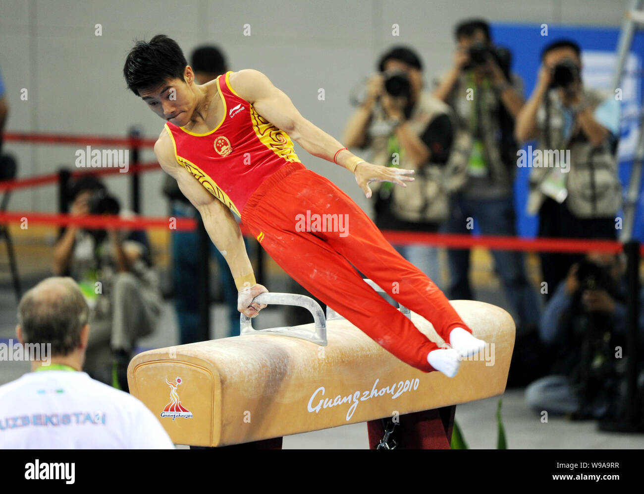 Chinas Teng Haibin competes on the pommel horse in the mens individual all-around final at the 16th Asian Games in Guangzhou city, south Chinas Guangd Stock Photo
