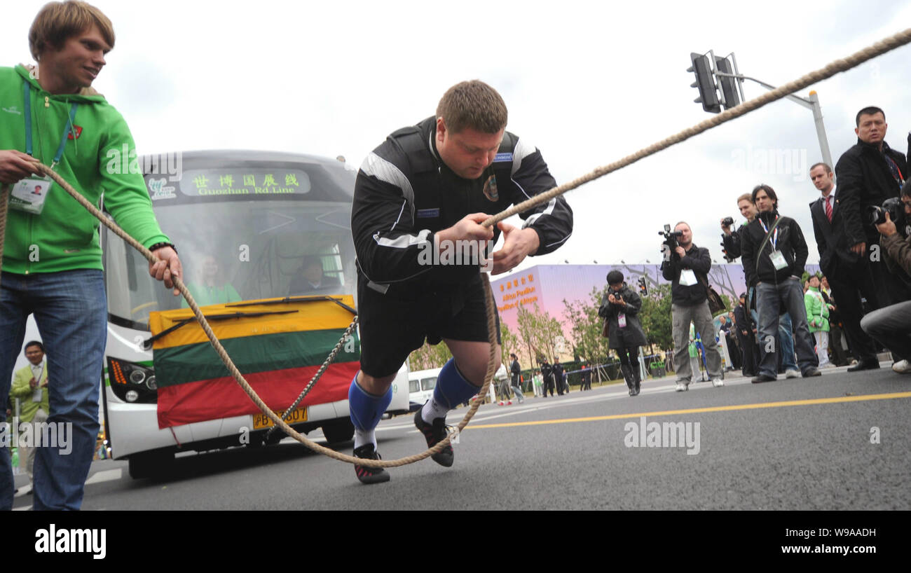 The Worlds Strongest Man title holder Zydrunas Savickas pulls a bus to ...