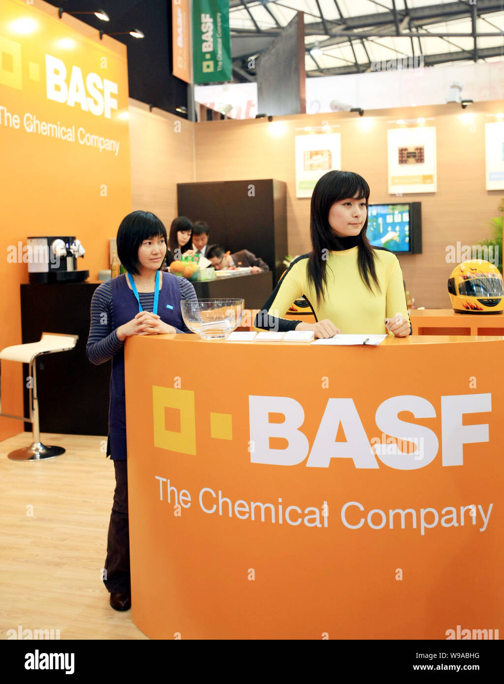 File Chinese Staff Stand On The Booth Of Basf During A Fair In