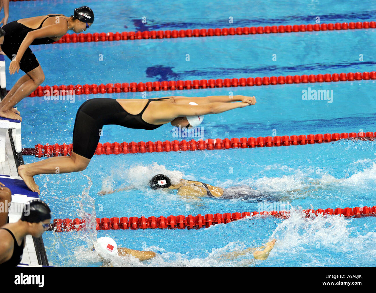 Swimmers compete in the womens 4x100m freestyle relay final at the 16th
