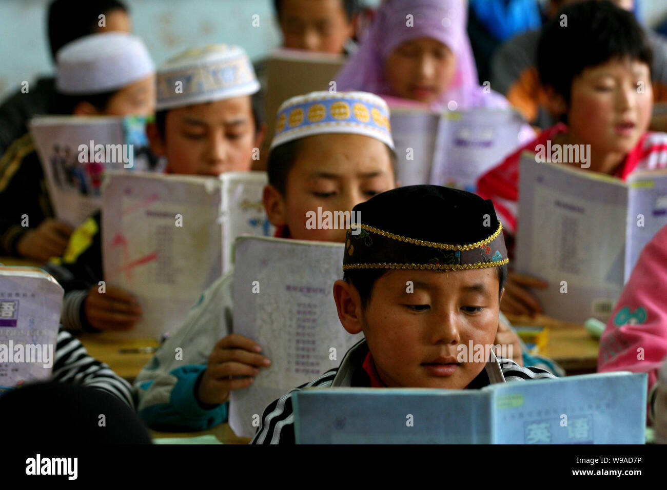Hui ethnic students are seen during a lesson at the Heping Primary School in Linxia, northwest Chinas Gansu province, June 30, 2010.   Heping Primary Stock Photo