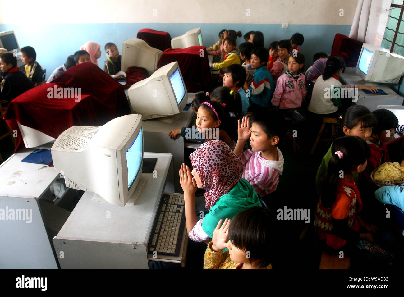 Hui ethnic students are seen during a computer lesson at the Heping Primary School in Linxia, northwest Chinas Gansu province, June 30, 2010.   Heping Stock Photo