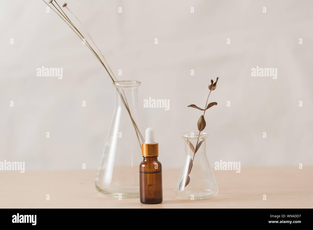 Cosmetic bottle stock images. Brown cosmetic bottle with batcher. Vials on a white background Stock Photo