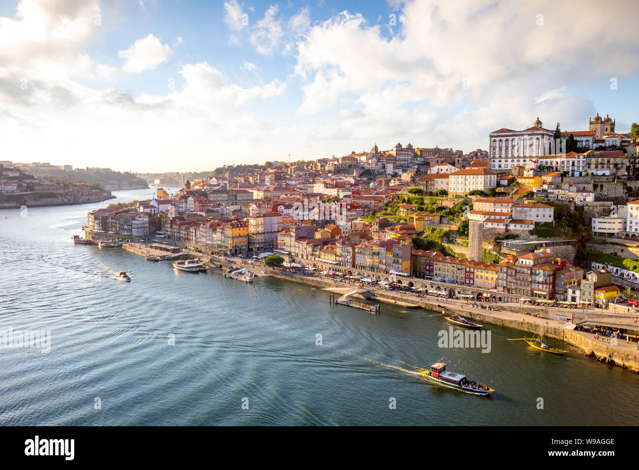 View to Porto over river Douro with reflection of the lights at sunset Stock Photo